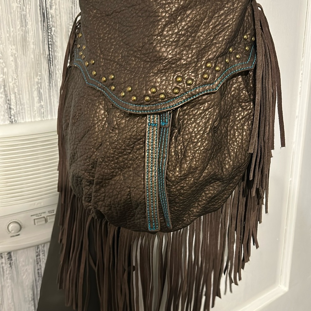 Bronze shoulder bag with turquoise stitching with fringes